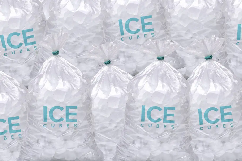 Bags of ice in a grocery store cooler