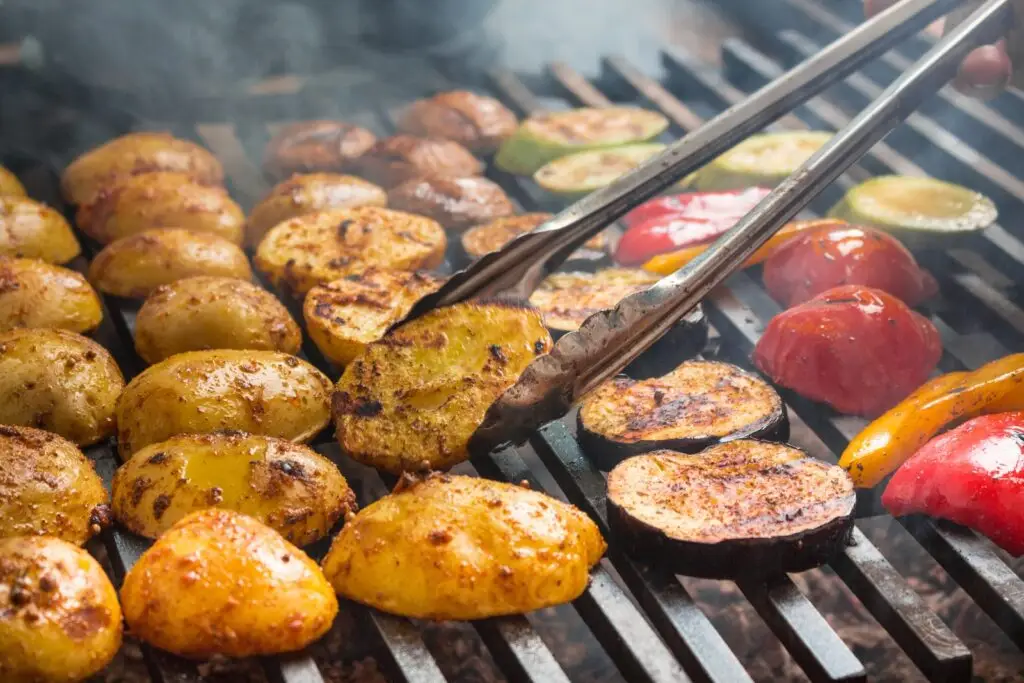 Grilled vegetables cooking on a charcoal grill